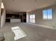 Bright and airy living room with large windows and access to a deck at 393 Grey Rock St, Brighton, CO 80601