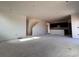 Open concept living room with high ceilings and a staircase at 393 Grey Rock St, Brighton, CO 80601