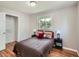 Cozy bedroom with a comfortable bed, hardwood floors, and ample natural light at 3750 S Galapago St, Englewood, CO 80110