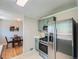 Cozy dining area featuring a round table with seating for four at 3750 S Galapago St, Englewood, CO 80110