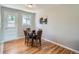 Charming dining area with hardwood floors, a round table, and comfortable seating at 3750 S Galapago St, Englewood, CO 80110