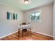 A home office featuring hardwood floors, bright light, and a modern-styled desk and chair at 3750 S Galapago St, Englewood, CO 80110