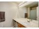 Bathroom featuring a long vanity with a white countertop and a large mirror at 4120 E 119Th Pl # B, Thornton, CO 80233