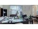 Bedroom featuring a large desk, window with blinds, and collectibles on the desk at 4120 E 119Th Pl # B, Thornton, CO 80233