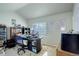 Bedroom featuring a large desk, window with blinds, and carpeting flooring at 4120 E 119Th Pl # B, Thornton, CO 80233