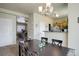 Open-concept dining area flows into the living room and kitchen, perfect for entertaining at 4120 E 119Th Pl # B, Thornton, CO 80233