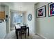 Bright dining room featuring a chandelier, large window, neutral walls, and carpet flooring at 4120 E 119Th Pl # B, Thornton, CO 80233