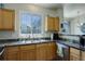Beautiful kitchen with a breakfast bar, wood cabinets and natural lighting at 4120 E 119Th Pl # B, Thornton, CO 80233