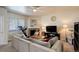 Cozy living room with a stone fireplace, a large sectional, and plenty of natural light at 4120 E 119Th Pl # B, Thornton, CO 80233