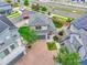 Aerial view of the home showcasing a paved driveway, manicured front lawn, and a well-maintained roof at 5131 Andes St, Denver, CO 80249