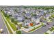 Community aerial view showcasing manicured lawns and houses with solar panels on some roofs at 5131 Andes St, Denver, CO 80249
