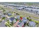 Aerial view of neighborhood homes and the adjacent shopping center at 5131 Andes St, Denver, CO 80249