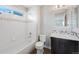 Well-lit bathroom featuring a bathtub and sleek vanity design at 11010 Grayledge Cir, Highlands Ranch, CO 80130