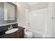 Bathroom features a tiled shower, soaking tub and vanity with dark countertops at 11010 Grayledge Cir, Highlands Ranch, CO 80130