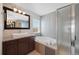 Luxurious bathroom featuring a soaking tub and modern fixtures at 11010 Grayledge Cir, Highlands Ranch, CO 80130