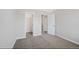 Bedroom featuring neutral carpet and doors to closets at 11010 Grayledge Cir, Highlands Ranch, CO 80130