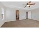 Spacious primary bedroom with a ceiling fan and neutral decor at 11010 Grayledge Cir, Highlands Ranch, CO 80130