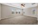 Spacious main bedroom with tray ceilings, ceiling fan and plenty of natural light at 11010 Grayledge Cir, Highlands Ranch, CO 80130