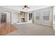 Spacious living room with a stone fireplace, hardwood floors and a sliding glass door at 11010 Grayledge Cir, Highlands Ranch, CO 80130