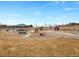 Community playground with a picnic shelter, play equipment and benches in a well-maintained green space at 11010 Grayledge Cir, Highlands Ranch, CO 80130