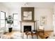 Living room with a beautifully tiled fireplace, modern decor, and lots of natural light at 1016 28Th St, Denver, CO 80205