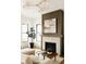 Living room with a beautifully tiled fireplace, modern decor, and lots of natural light at 1016 28Th St, Denver, CO 80205