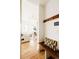 View of the open floor plan of the living room from the hallway with coat rack and bench at 1016 28Th St, Denver, CO 80205
