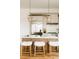 Modern kitchen featuring a large island with counter seating, stainless steel appliances, and custom cabinets at 1016 28Th St, Denver, CO 80205
