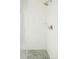 Modern bathroom shower featuring white subway tile and pebble tile floor at 1016 28Th St, Denver, CO 80205