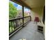 Relaxing balcony with views of lush greenery, providing a serene outdoor space and red chair at 14852 E Kentucky Dr # 934, Aurora, CO 80012