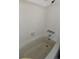 Clean, tiled bathtub and shower combination perfect for relaxation in a bright, simple bathroom at 14852 E Kentucky Dr # 934, Aurora, CO 80012