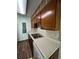 A well-lit kitchen with bright countertops, stainless steel sink, and plenty of cabinet space at 14852 E Kentucky Dr # 934, Aurora, CO 80012