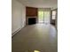 A bright living room with sliding doors to the balcony and a fireplace at 14852 E Kentucky Dr # 934, Aurora, CO 80012