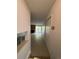 A bright hallway leading into the living room with fireplace and sliding doors to the balcony at 14852 E Kentucky Dr # 934, Aurora, CO 80012