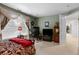 Bedroom with a bed, window with curtains, desk, and access to another room at 9567 Brentwood Way # A, Broomfield, CO 80021