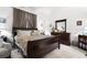 Comfortable bedroom featuring a large bed, dresser, and neutral decor at 9567 Brentwood Way # A, Broomfield, CO 80021