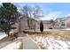 Well-maintained single-story home with rock garden landscaping and mature trees at 9567 Brentwood Way # A, Broomfield, CO 80021