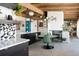 Open dining area with eye-catching light fixture, stylish dining table, and convenient access to other living spaces at 3605 W Berry Ave, Littleton, CO 80123
