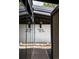 Entryway with mirrored wall, gravel accents and modern address plaque on the house at 3605 W Berry Ave, Littleton, CO 80123
