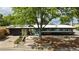 Inviting single-story home with xeriscaping, stone pathway, and a beautiful, mature shade tree at 3605 W Berry Ave, Littleton, CO 80123