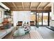 Bright living room featuring an open floor plan and sliding glass doors to the backyard at 3605 W Berry Ave, Littleton, CO 80123