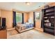 Finished basement bedroom with neutral walls and a bookshelf at 9850 Sunset Hill Circle Cir, Lone Tree, CO 80124