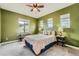 Bright bedroom featuring a comfortable bed, large windows, and neutral decor at 9850 Sunset Hill Circle Cir, Lone Tree, CO 80124