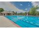 Community swimming pool with lounge chairs at 9850 Sunset Hill Circle Cir, Lone Tree, CO 80124