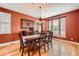 Formal dining room with hardwood floors and a chandelier at 9850 Sunset Hill Circle Cir, Lone Tree, CO 80124