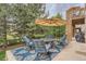 Spacious patio with seating area and outdoor rug at 9850 Sunset Hill Circle Cir, Lone Tree, CO 80124