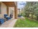 Covered patio with seating area and backyard access at 9850 Sunset Hill Circle Cir, Lone Tree, CO 80124