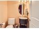 Convenient powder room with pedestal sink and oval mirror at 9850 Sunset Hill Circle Cir, Lone Tree, CO 80124