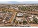 Home from above, adjacent to train tracks, businesses and auto salvage yards. Downtown is in the background at 5182 Thompson Ct, Denver, CO 80216