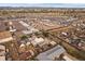 Extensive aerial view of a sprawling industrial lot with multiple vehicles and a distant mountain range at 5182 Thompson Ct, Denver, CO 80216